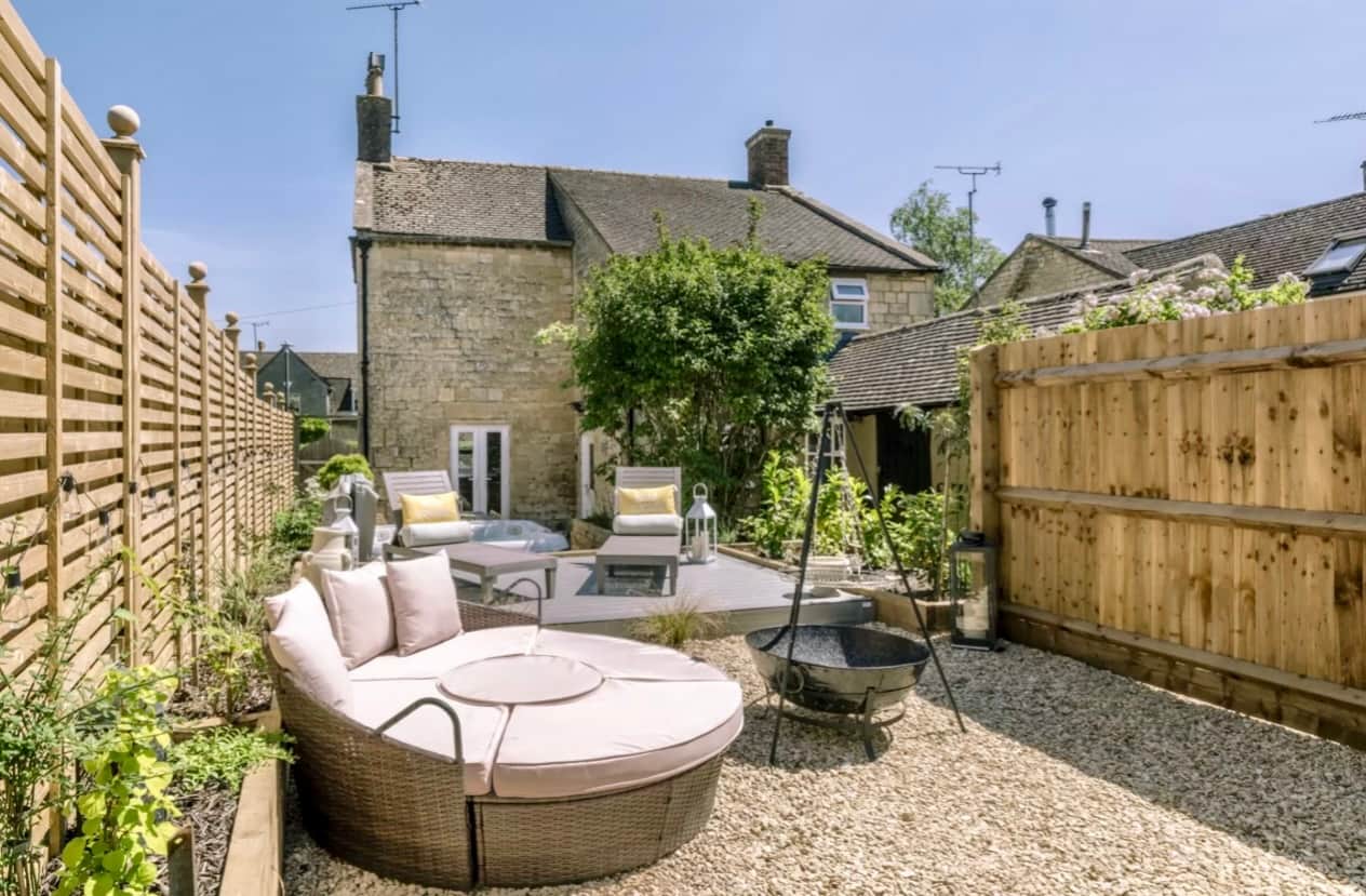 Private landscaped garden with seating and fire pit