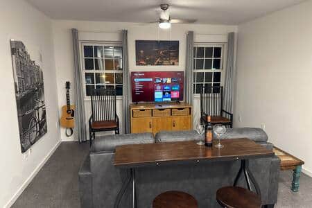Well appointed and super comfortable living room.  Chaise Sofa and bistro table.