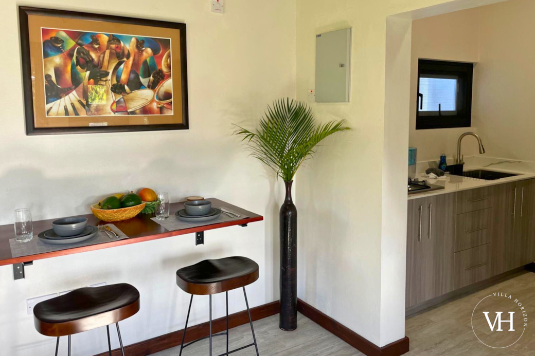 Kitchen features a cozy dining area for two.