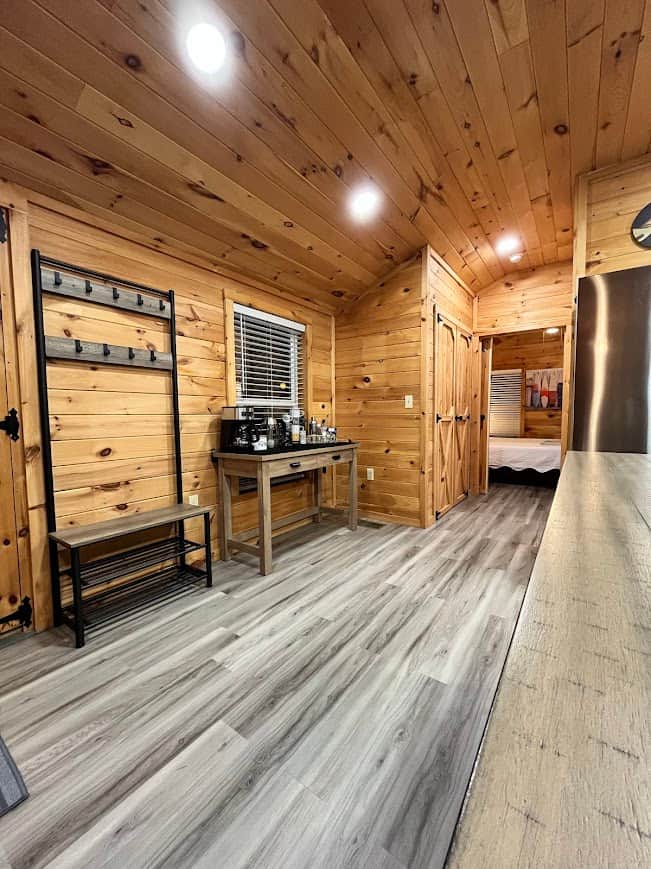Entry coat/shoe rack and coffee bar.