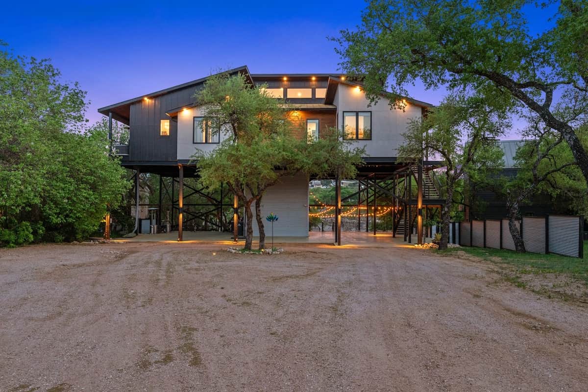 Private waterfront home beneath mature Hill Country trees