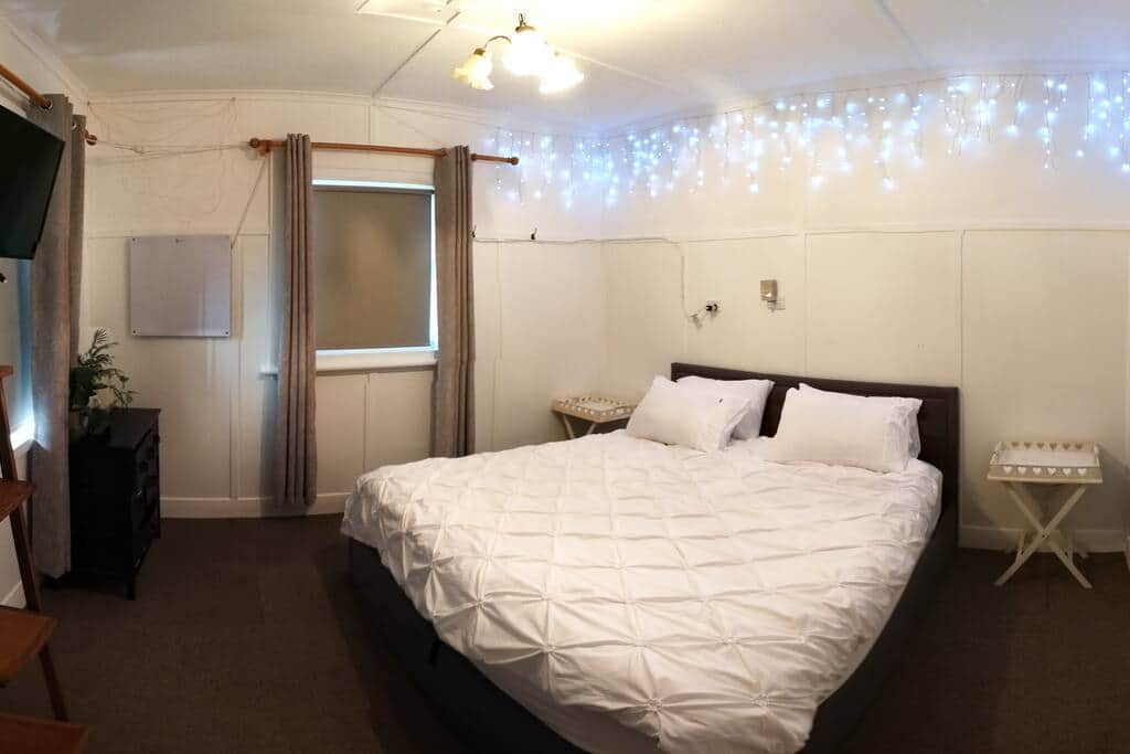 Spacious master bedroom with king bed.