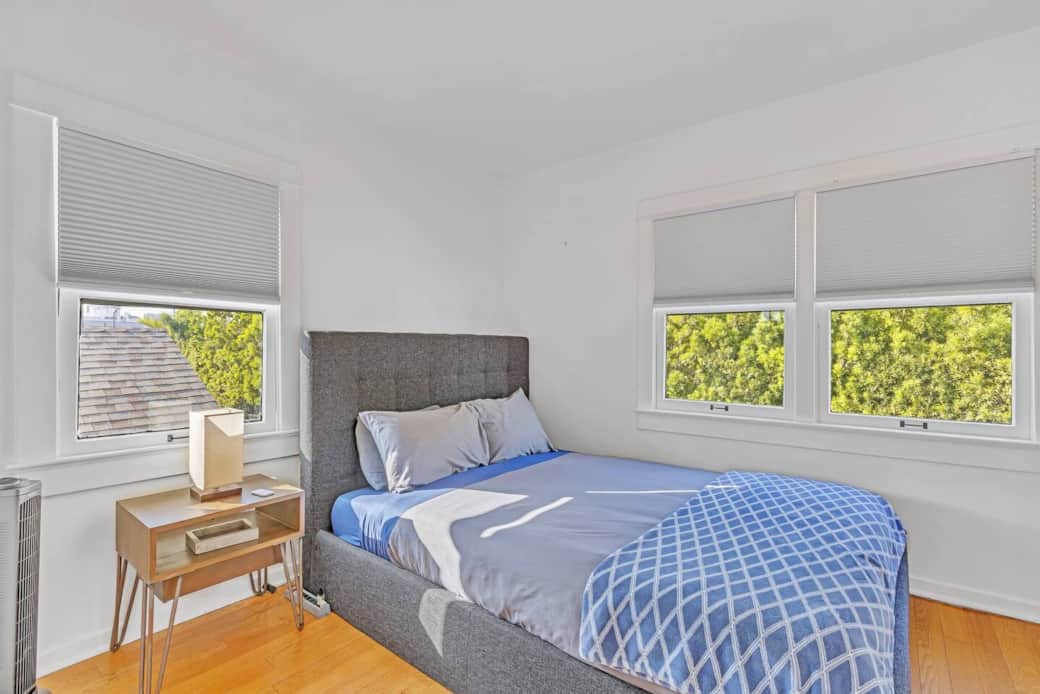 A peaceful bedroom offering a queen bed with ample clothing storage. A peaceful bedroom offering a queen bed with ample clothing storage.