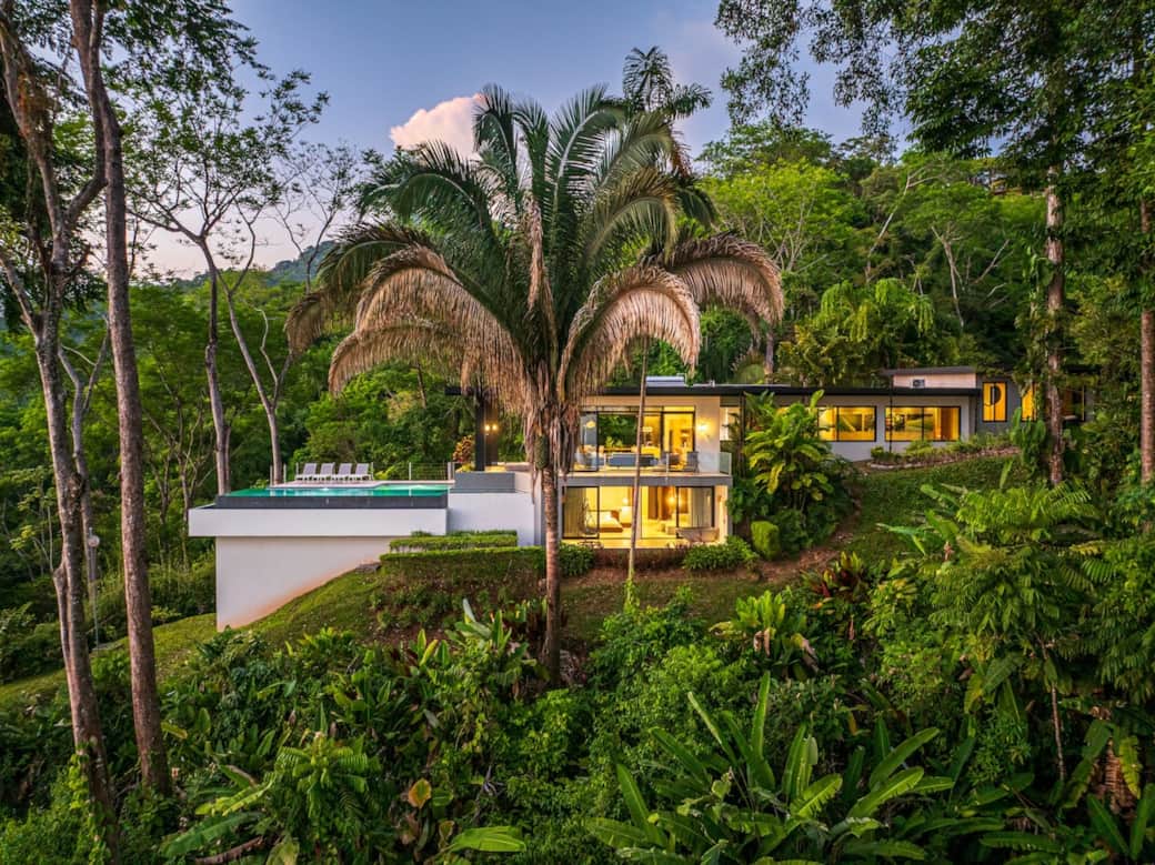 Exterior view of Casa Cosara Grande and the infinity pool  from the jungle. 