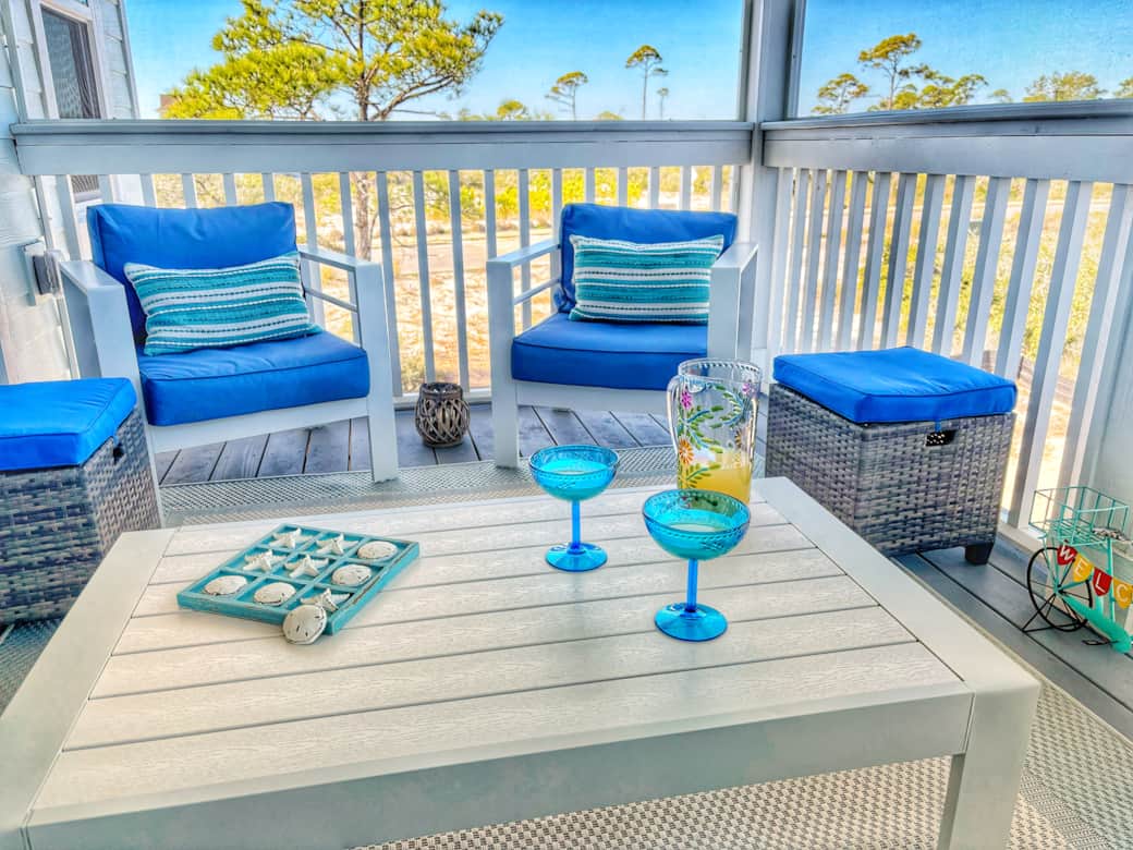 Located off the main area, enjoy the serenity of the porch...Gulf breezes melt your cares away.