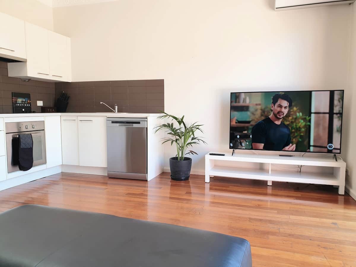 Kitchen and lounge area and 58 inch TV