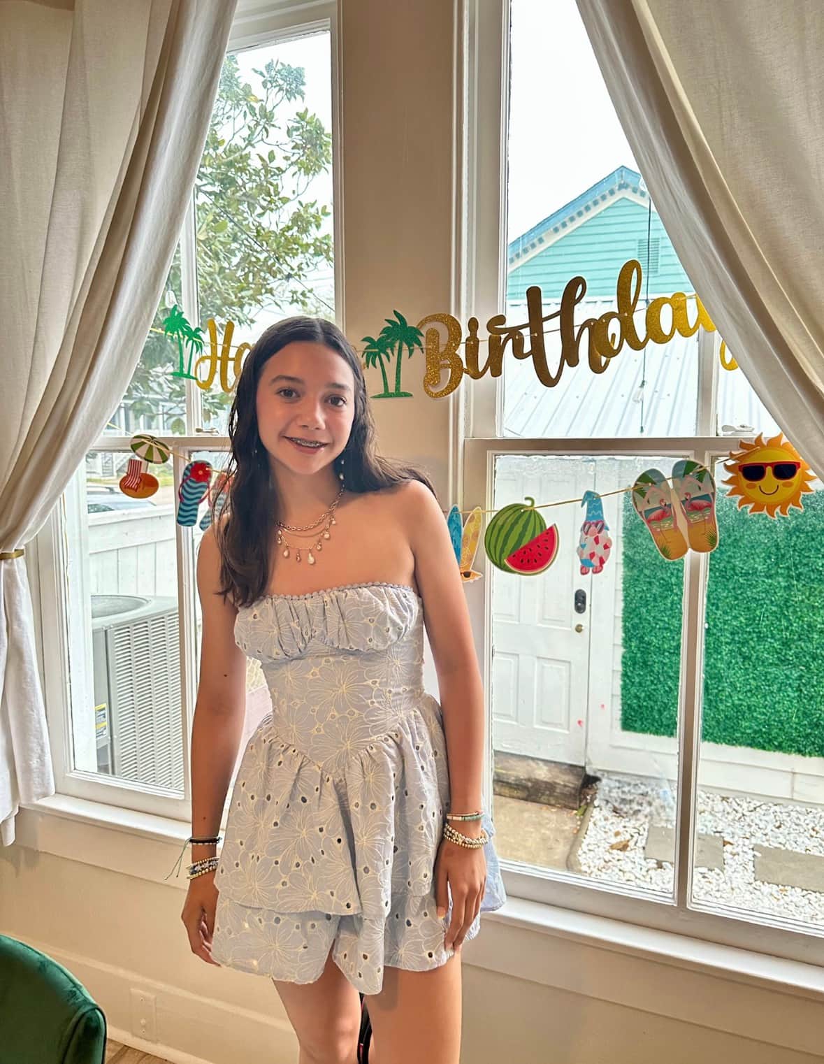 Teen wearing a Birthday Queen sash during her Spring Break stay at White Magnolia Galveston