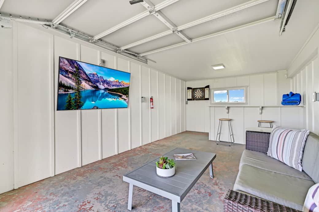 Bar area with dart board and smart tv.