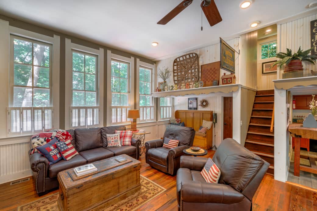 Bright great room invites guests to gather, relax, and enjoy the schoolhouse character Bright great room invites guests to gather, relax, and enjoy the schoolhouse character