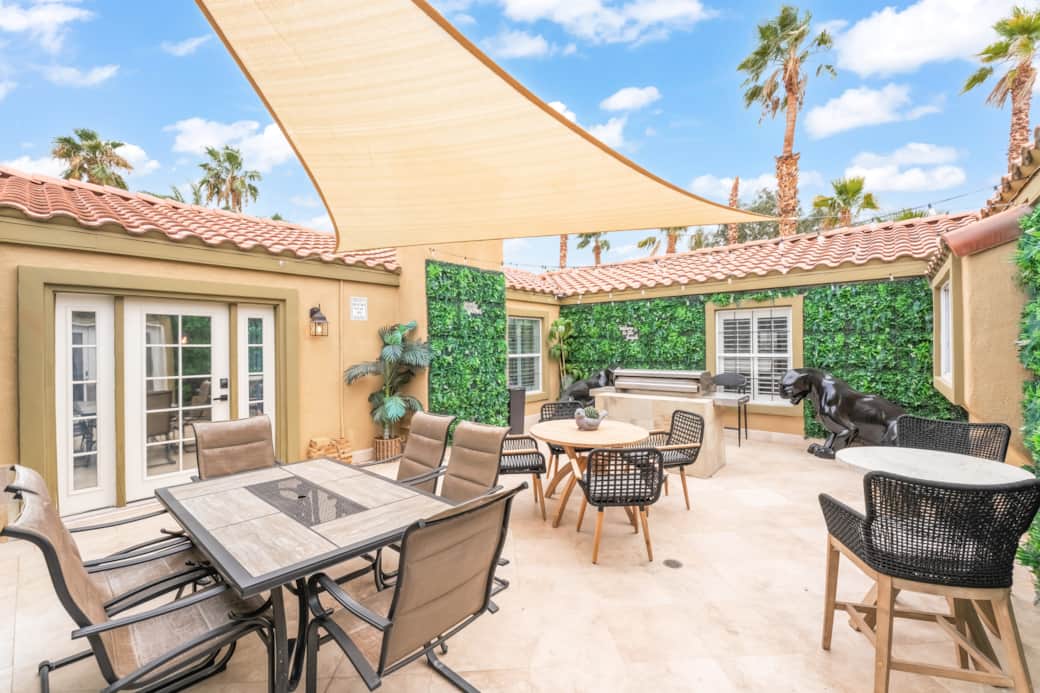 Jungle-themed center courtyard with shaded seating, outdoor dining, and BBQ