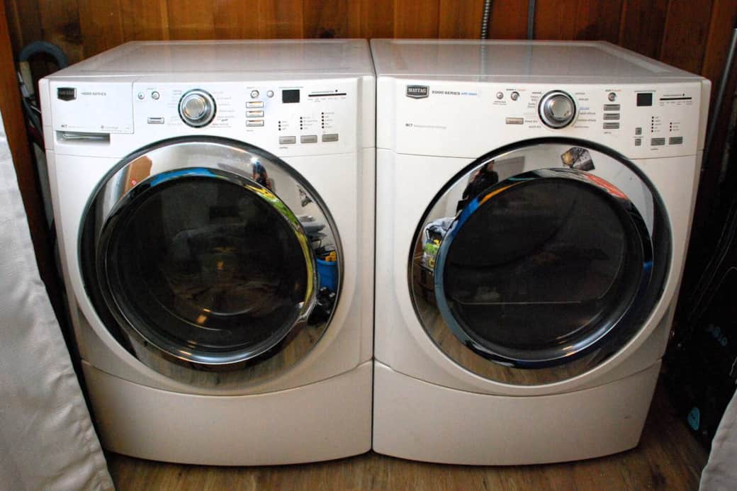 Laundry machines in bedroom closet
