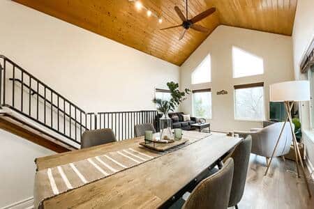 Overview of living room and dining room from dining room table. 
