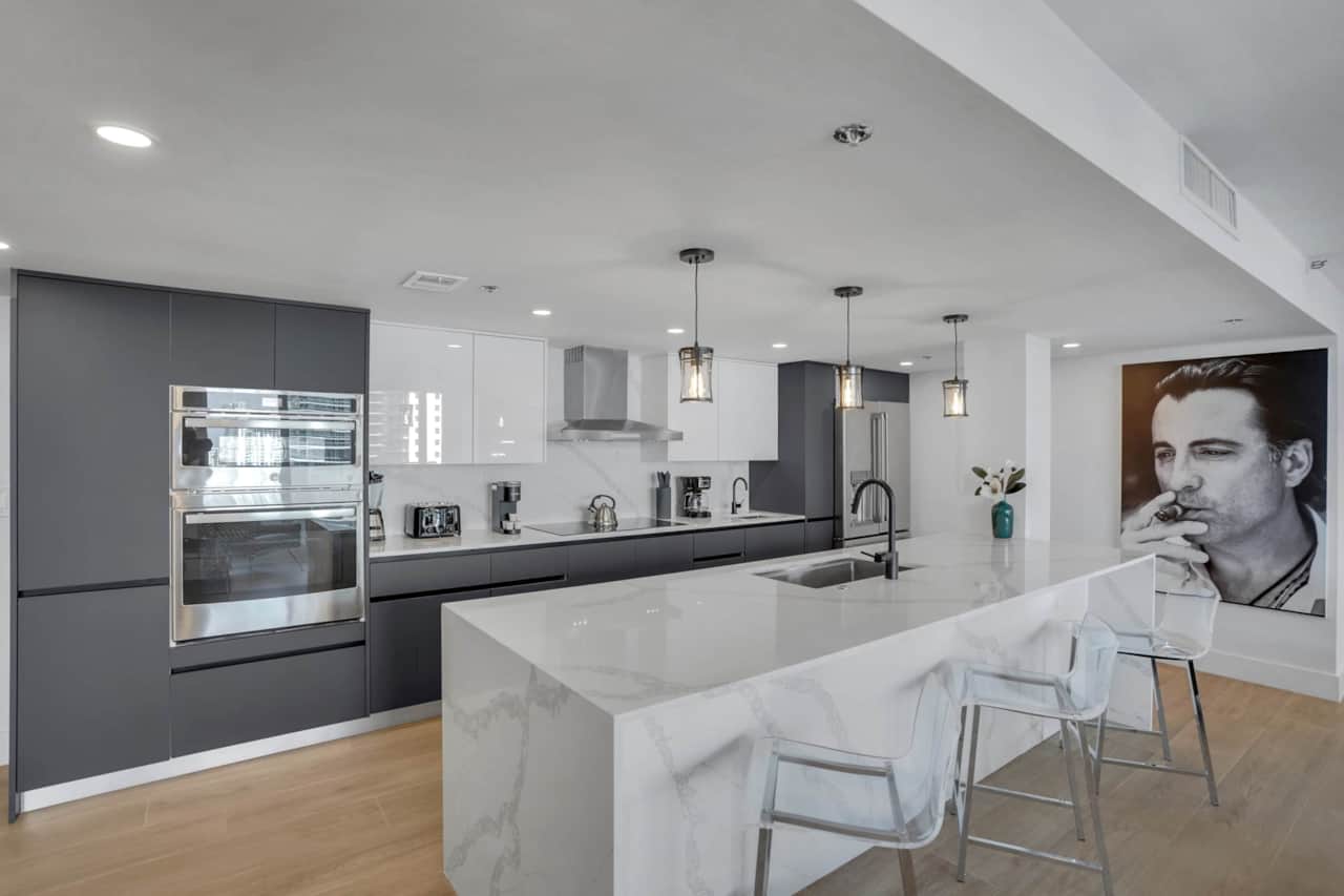 Open concept fully equipped kitchen with seating at counter for 3