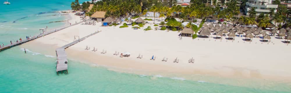 Aerial view of the white sand and turquoise shoreline of Isla Mujeres