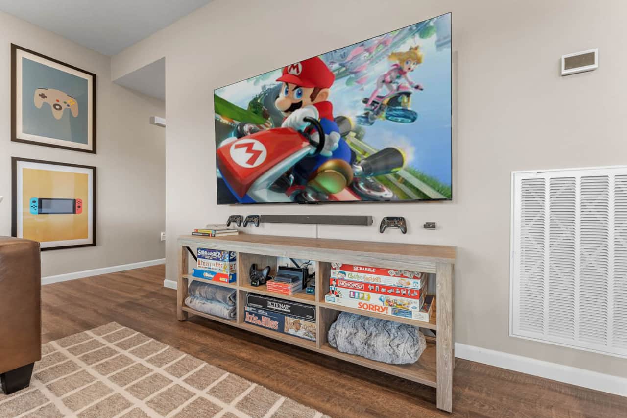 Living room with 75 inch TV and Nintendo Switch
