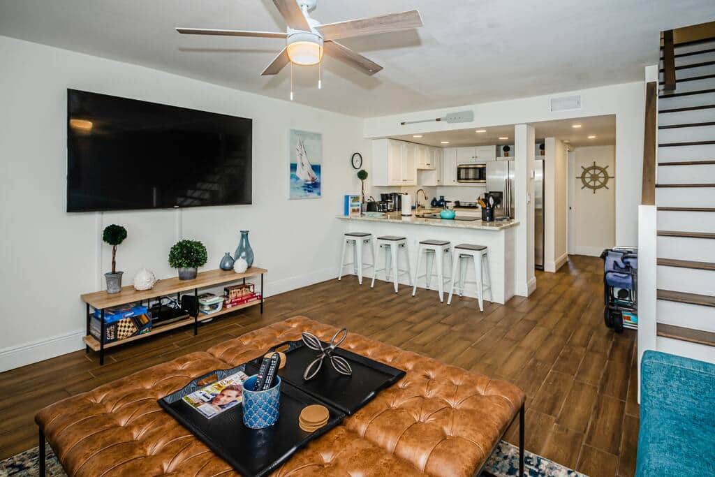 Living room with 65" LCD smart tv with access to Spectrum cable and other streaming apps.