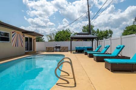 Sunbathe in style—spacious poolside haven with loungers perfect for groups to soak up the sun!