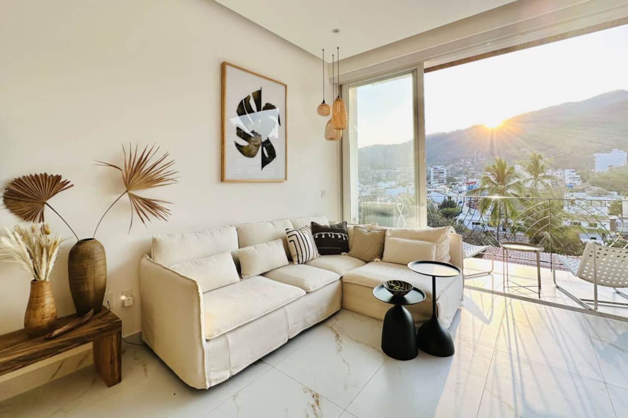 Living room/terrace view of sunrise over the Sierra Madre Mountains