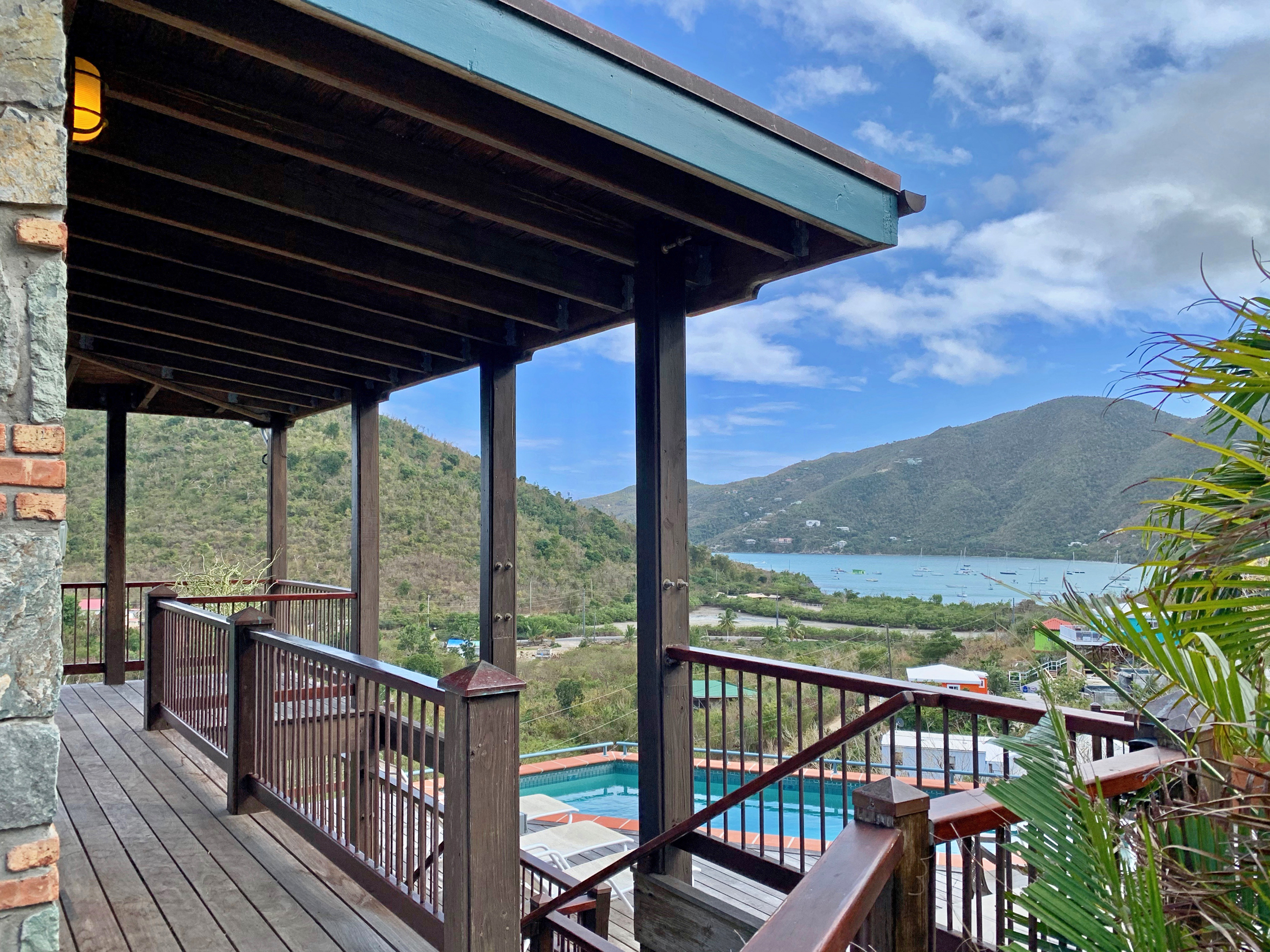 Exterior stairs leading to pool deck and lower bedrooms