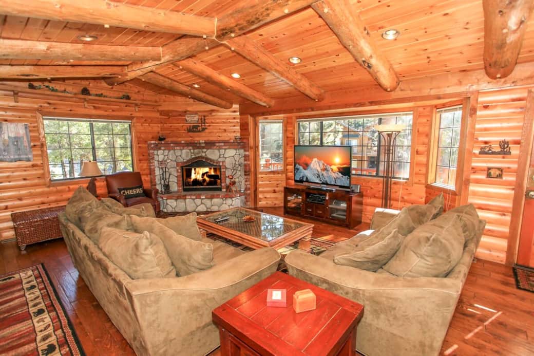 Living room with entertainment center, cable access and fireplace. Living room with entertainment center, cable access and fireplace.
