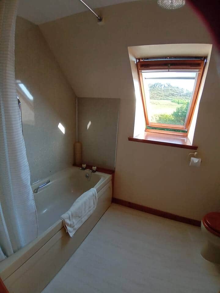 one of the 2 bathrooms.  Both bathrooms have electric showers over the baths, WC and Basin.  