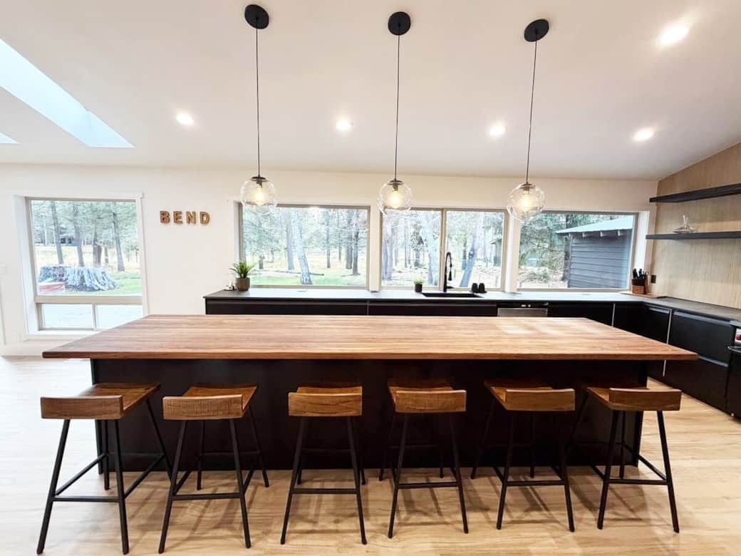 The heart of the home: A chef's kitchen with a massive island, perfect for social cooking and gathering.
