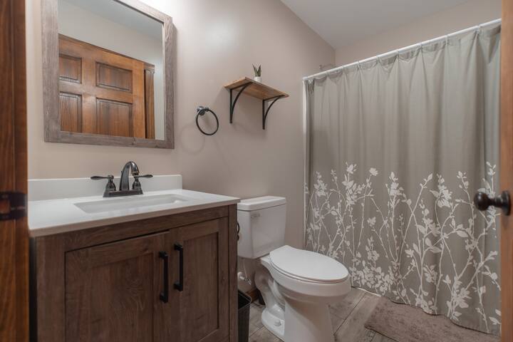 Freshen up and rejuvenate in our pristine bathroom oasis after a day of mountain adventures.