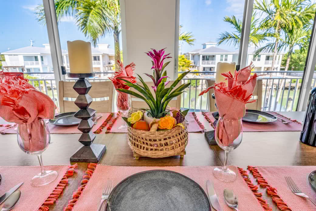 One of 3 dining areas. The main dining room has a view that looks out over the canal and palm trees.