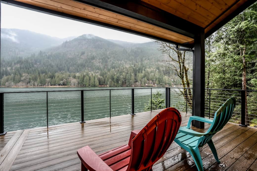 The deck overlooking the lake. There is a heat lamp in the ceiling for warmth in the cooler months.