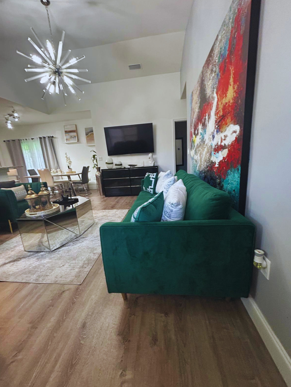 Smart TV with Netflix and a stylish coffee table for relaxing moments. Lakeland, FL