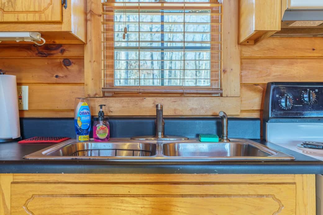 Hand soap, dish soap and a fresh dish sponge available. A fully stocked cabinet underneath the sink of all kitchen needs. 