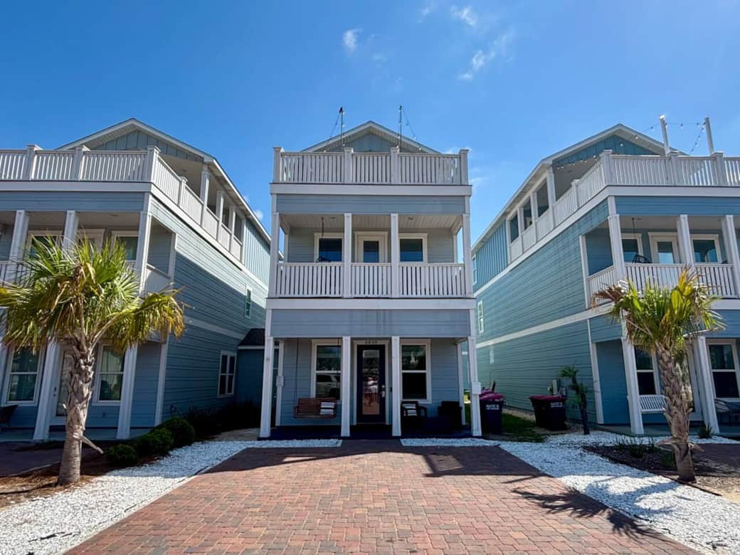 The Salty Blue welcomes you with a covered front patio featuring cozy chairs and a relaxing patio swing, perfect for soaking up ocean breezes or enjoying a quiet moment at sunset.