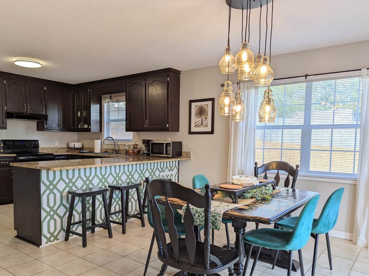 "Full kitchen — not 'hotel-style'. Cook a real meal. Bring the spices. The big table seats everyone 