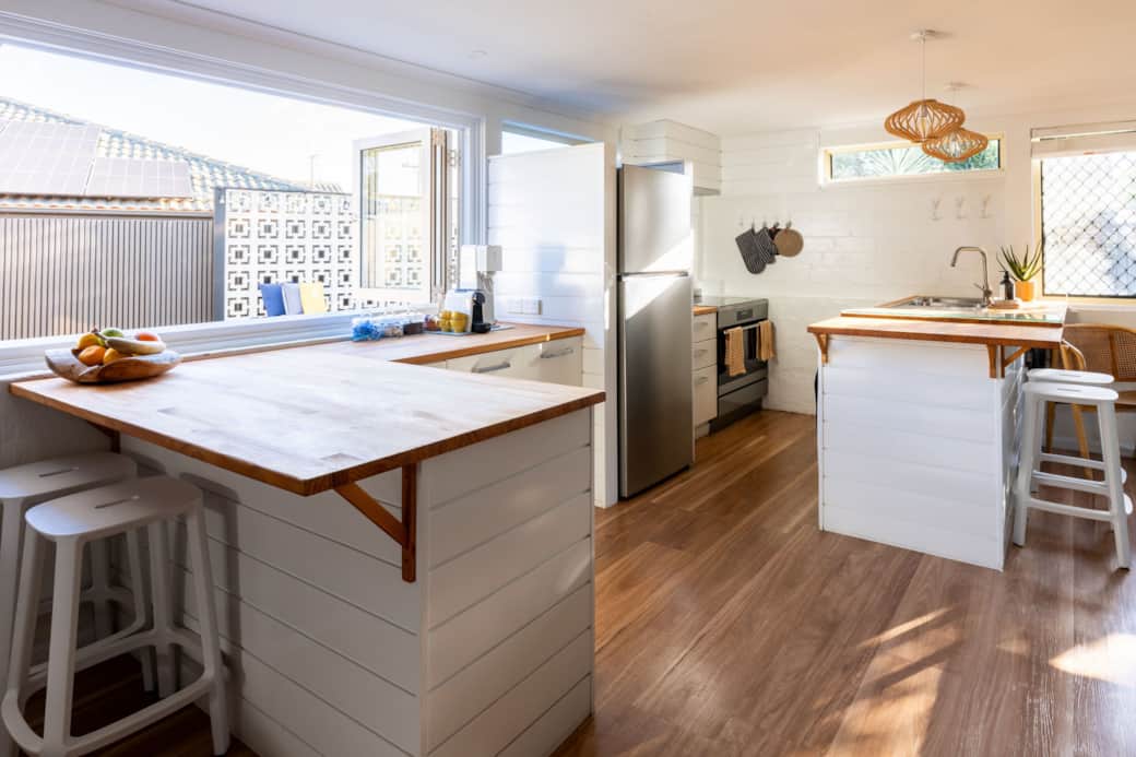 Modern kitchen with breakfast bar and view of outdoor fire pit