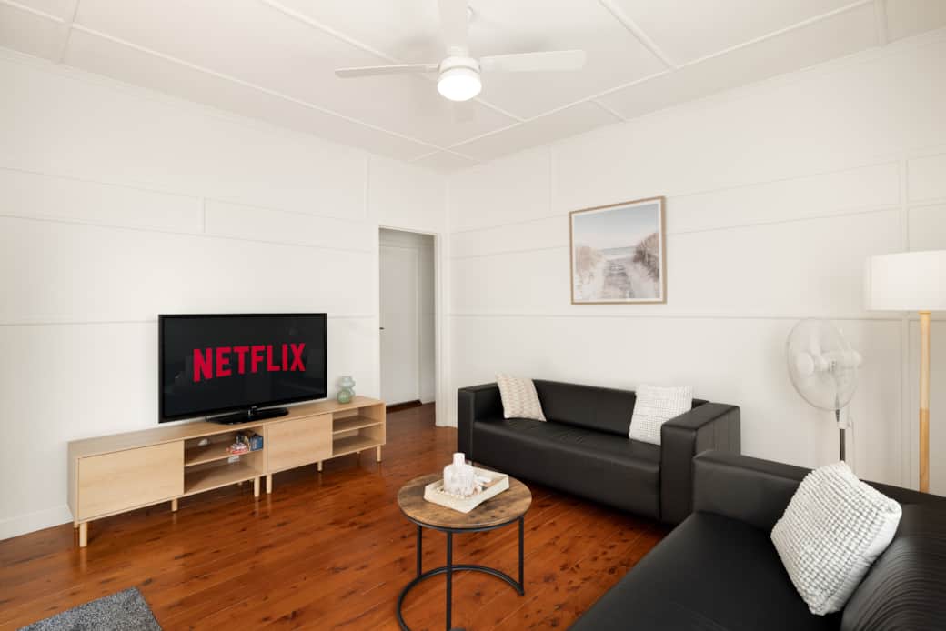 Living Area: Bright living space with comfortable seating and TV Living Area: Bright living space with comfortable seating and TV