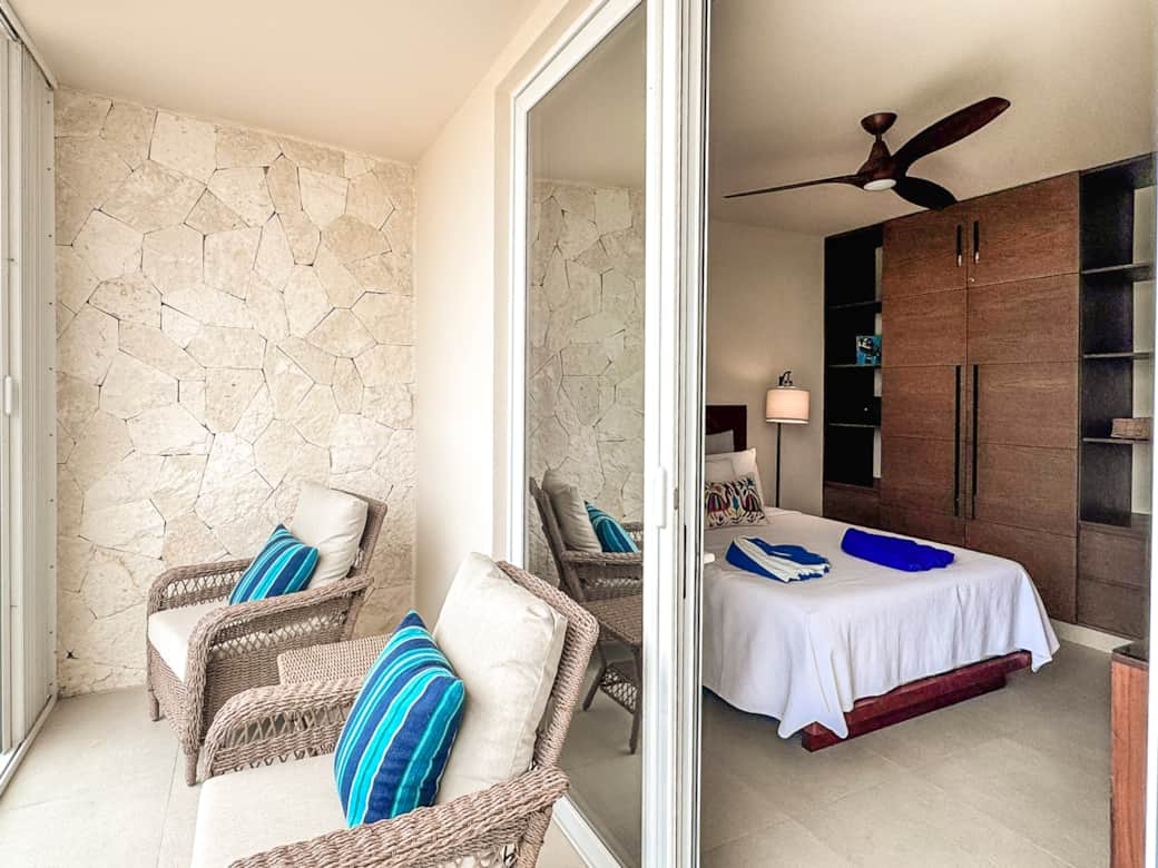 Step out to a private balcony with ocean views, breeze, wardrobe, and secure safe.