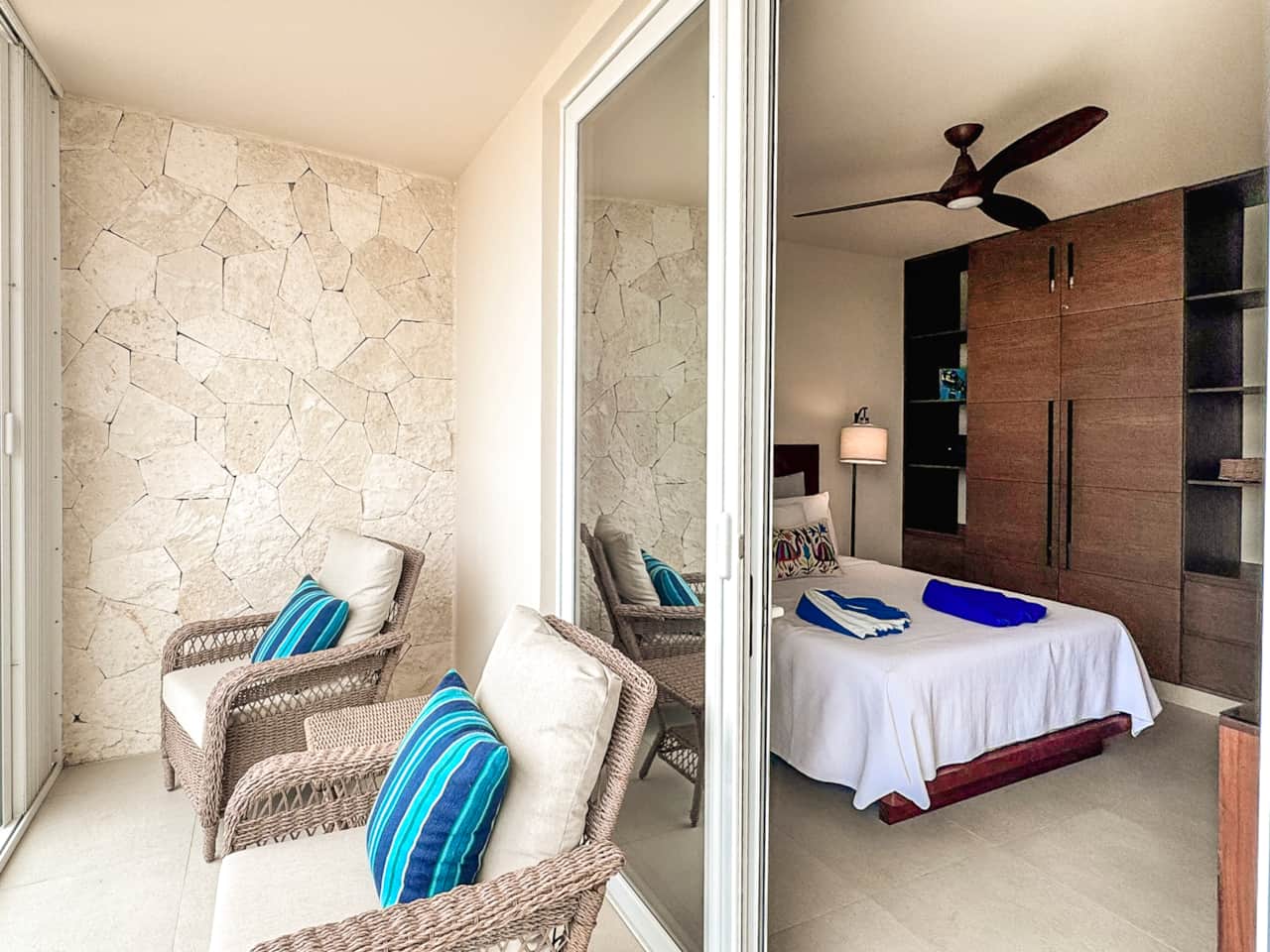 Step out to a private balcony with ocean views, breeze, wardrobe, and secure safe.
