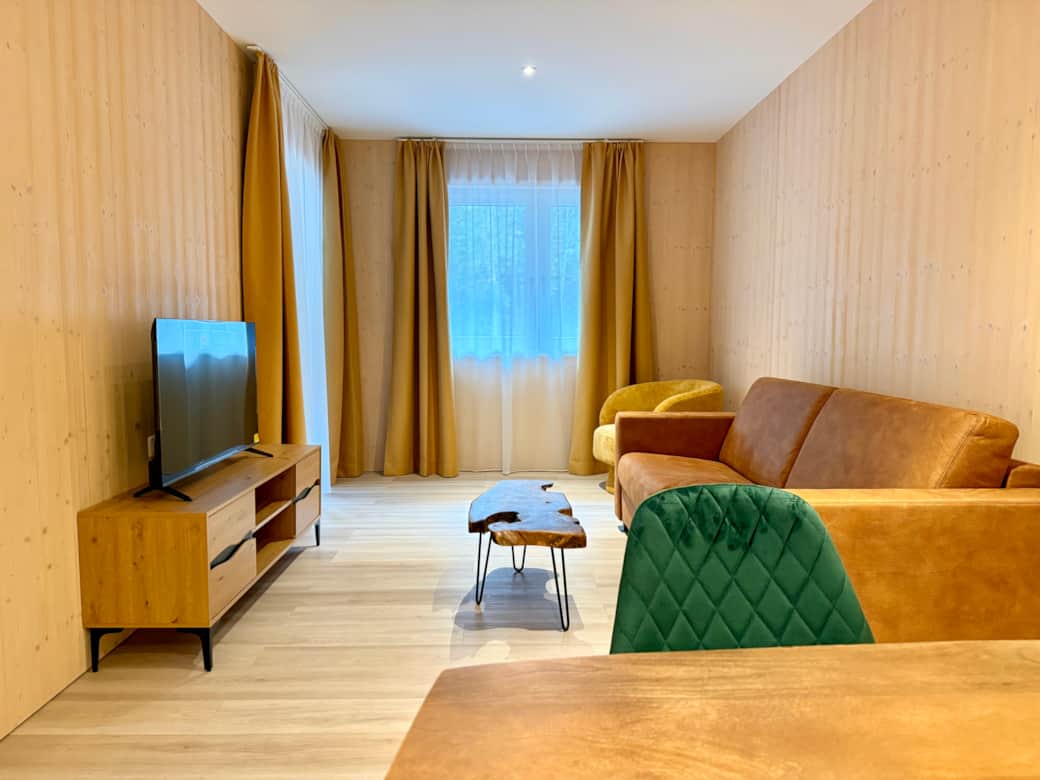 Living room with smart TV and balcony