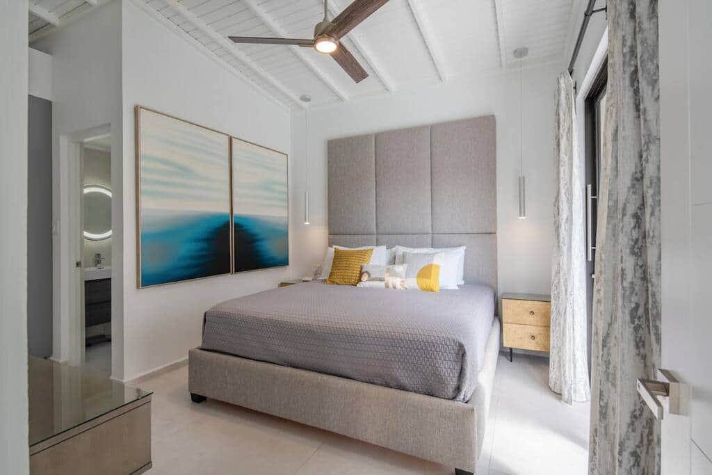 Bedroom 1 (Main floor): King bed, full ensuite, TV, A/C, fan, walkout to yard
