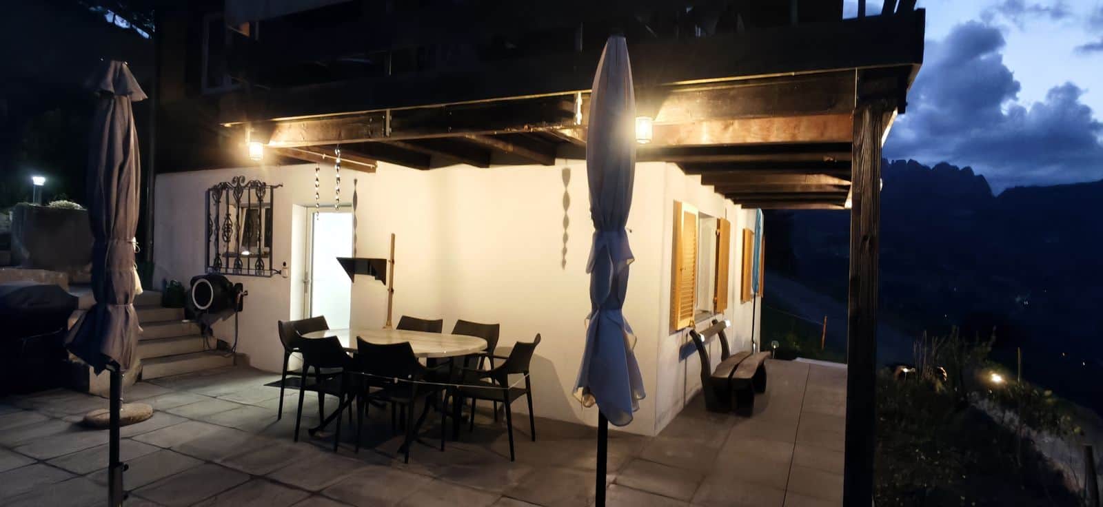 Illuminated terrace at Nebelmeer Chalet in the evening