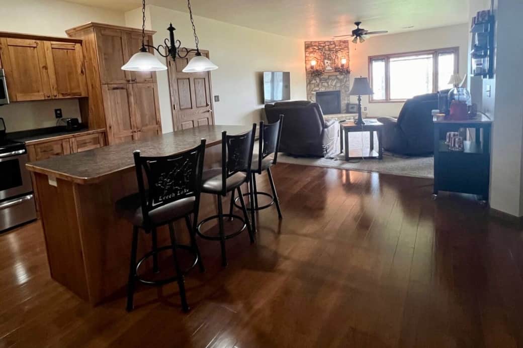 Kitchen opens up to large family room with gorgeous lake view