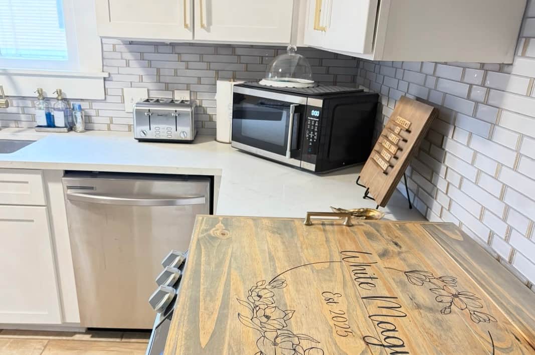 Kitchen appliances including coffee station with Keurig, toaster, and blender at White Magnolia