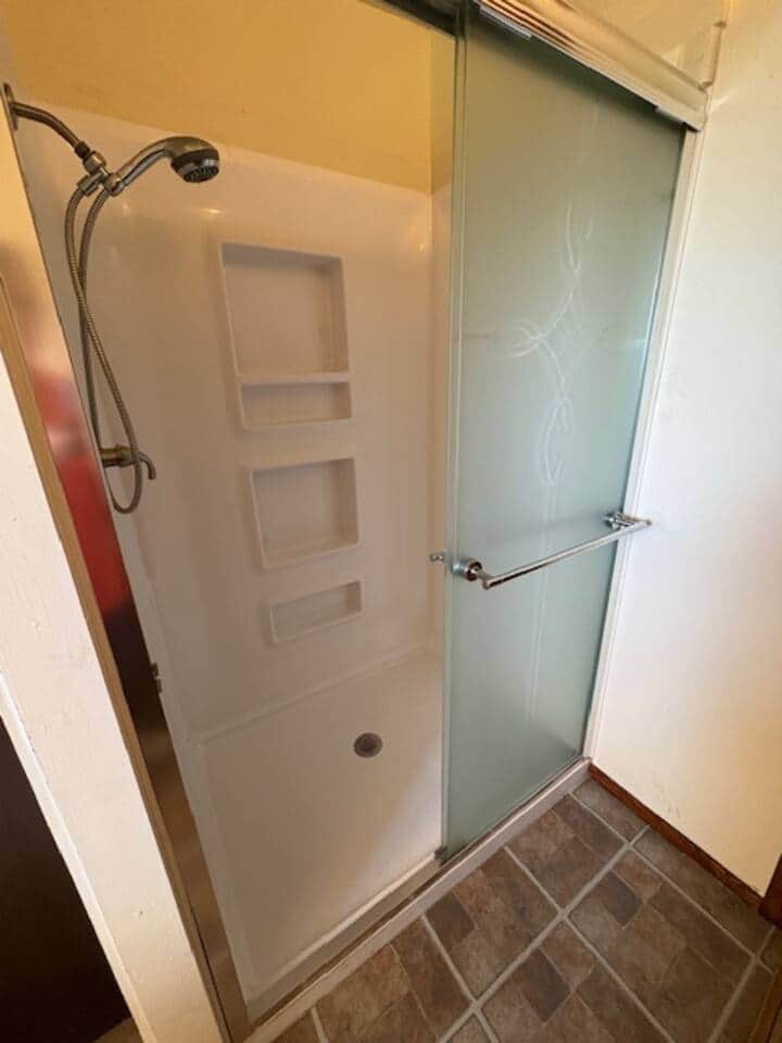 Large shower with a new shower wand and great water pressure.