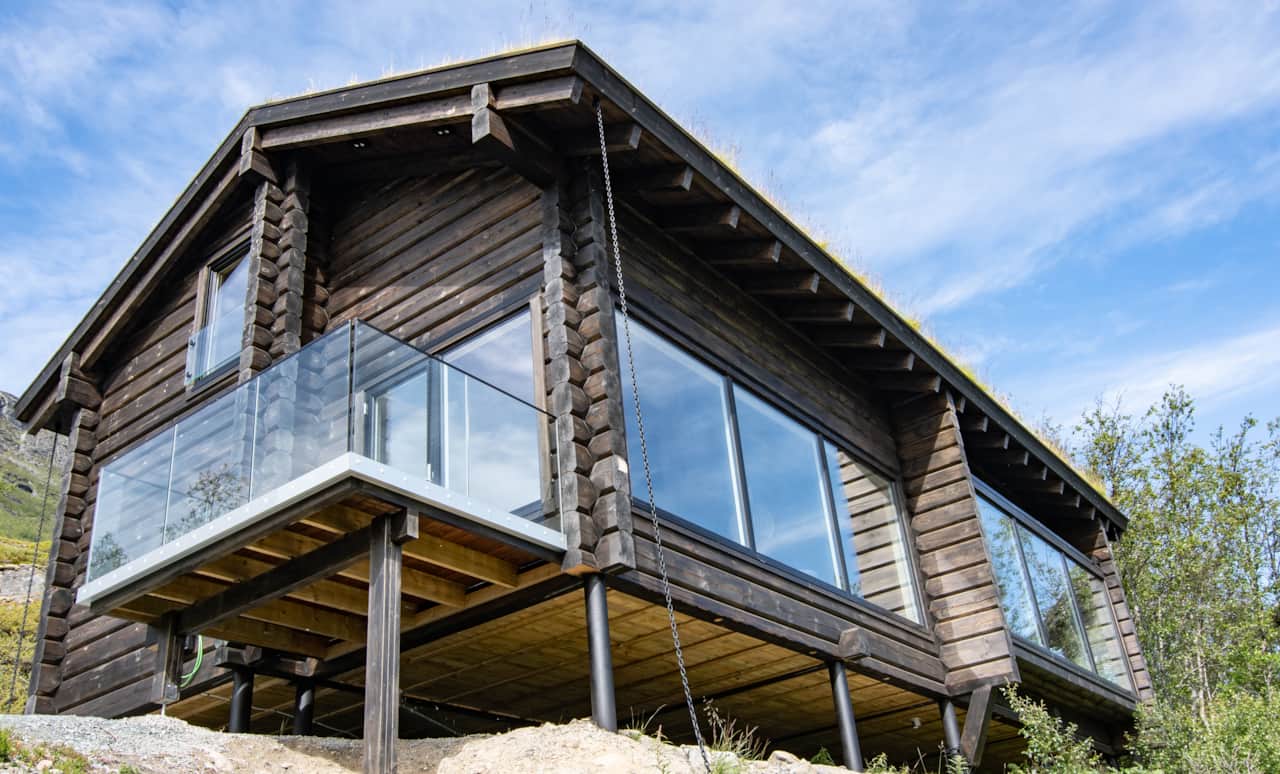 Nordlys cabin glass balcony overlooking Ulsfjord, Northern Norway