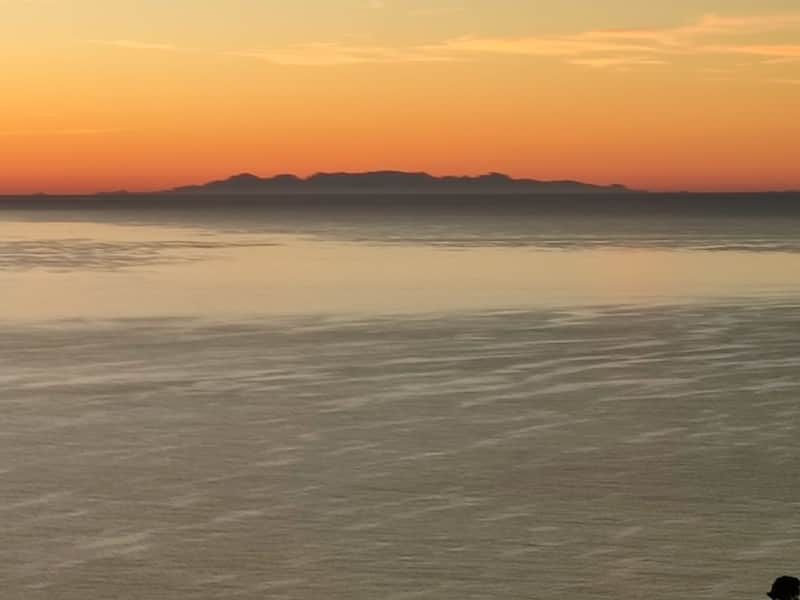 Corsica visible on the horizon at dusk from the terrace