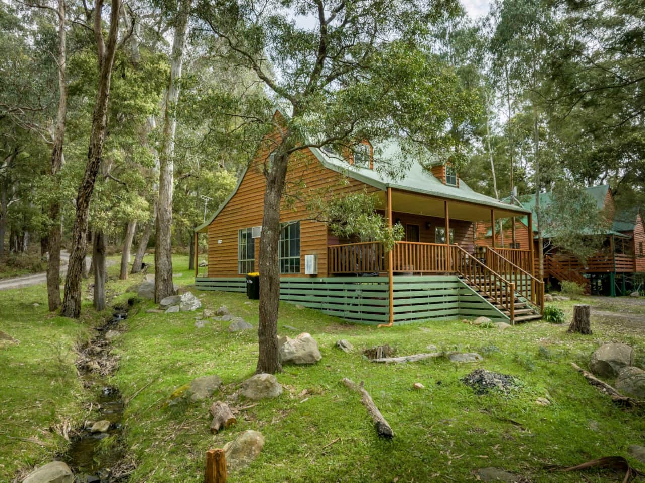 Seasonal creek flows through the property, adding natural charm.
