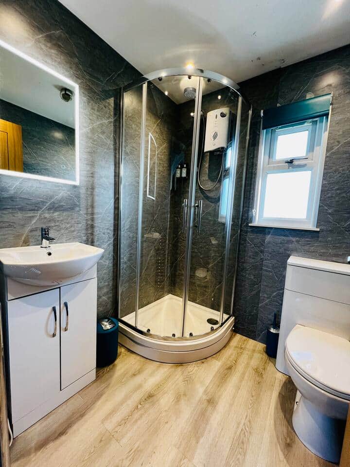 Modern bathroom with walk-in shower, basin and toilet