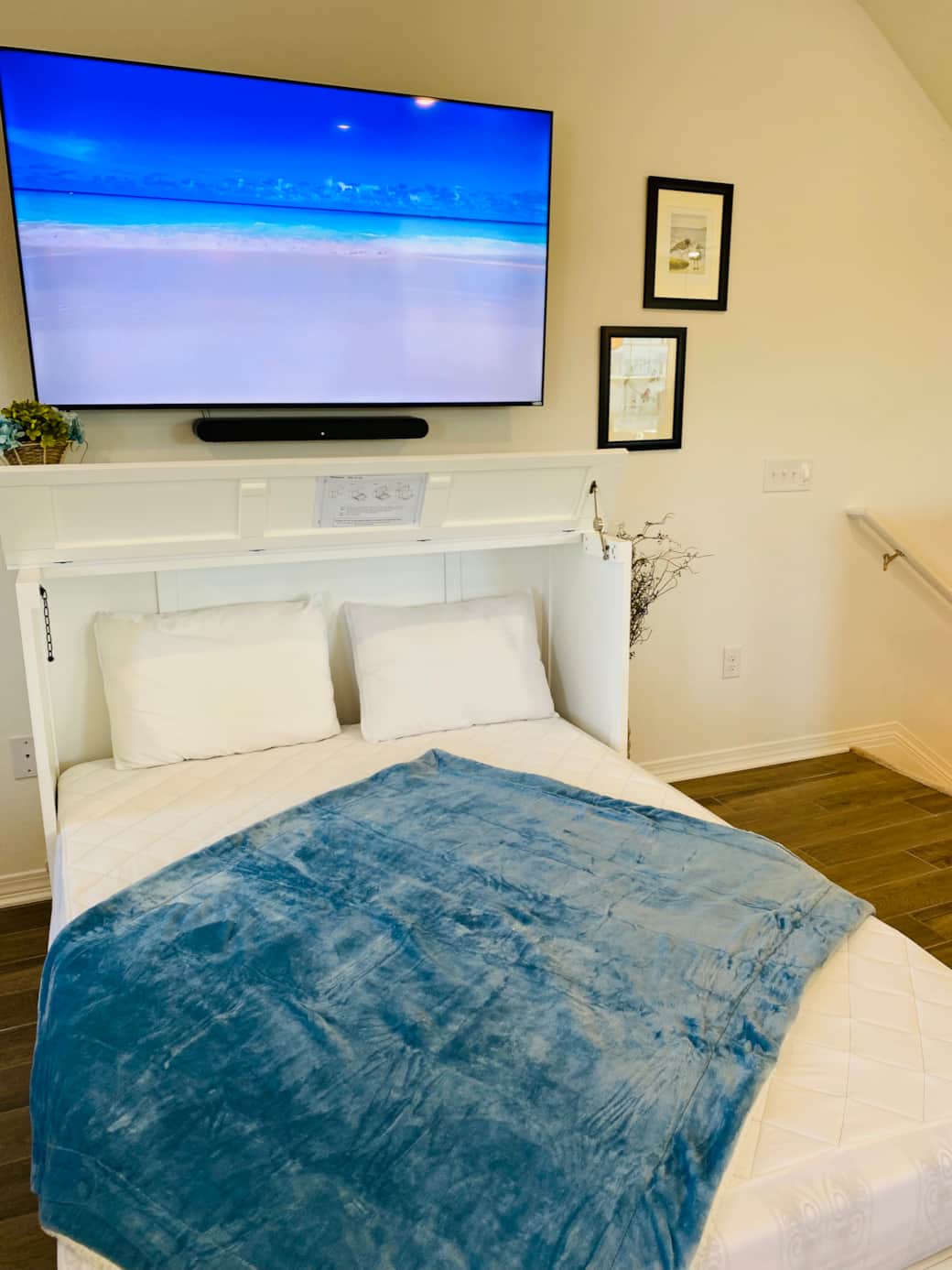 Queen Murphy bed easily opens into the living room and has comfy foam mattress