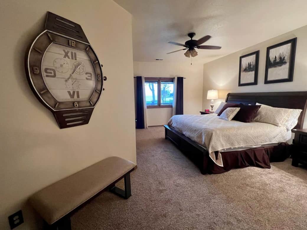 Primary bedroom features comfortable king-size bed