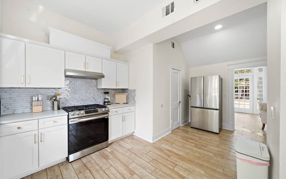 Stainless steel fridge with built-in ice maker.